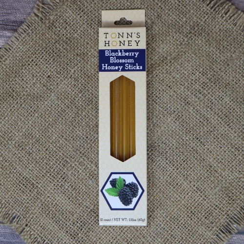 A box of Tonn's Blackberry Honey Sticks on rustic burlap.