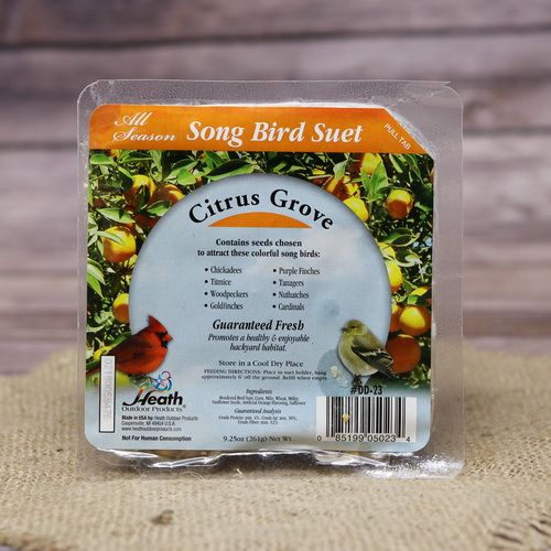 A square package of Citrus Grove Suet Cake on rustic burlap with a wooden background.