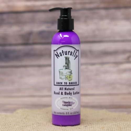An 8 oz pump bottle of Lavender Hand & Body Lotion, set on rustic burlap with a wooden background.