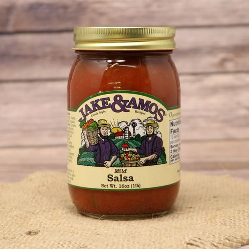 A pint size glass jar of Jake & Amos Mild Salsa, on rustic burlap with a wooden background.