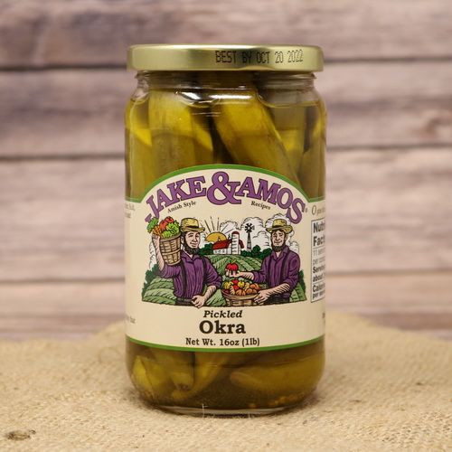 A pint size glass jar of Jake & Amos Pickled Okra, on rustic burlap with a wooden background.