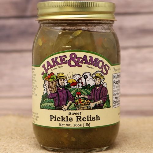 A pint size glass jar of Jake and Amos Sweet Pickle Relish, on rustic burlap with a wooden background.