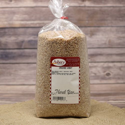 A clear plastic bag containing Cracked Wheat on rustic burlap with a wooden background.