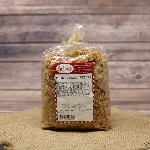 A bag of Original Granola sealed with a twist tie on rustic burlap with a wooden background.
