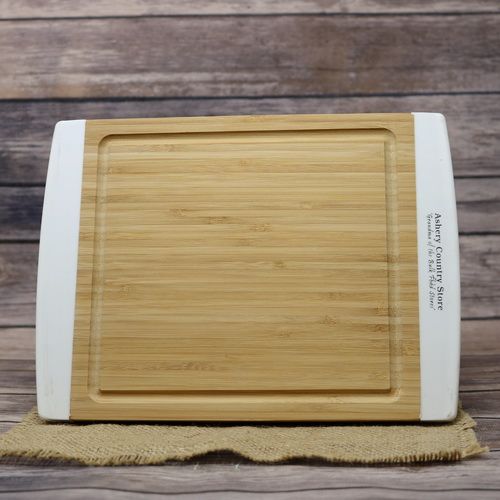 A bamboo Cutting Board on rustic burlap with a wooden background.