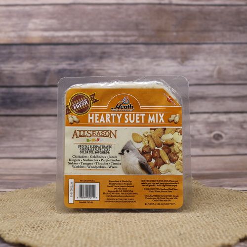 A square package of Hearty Suet Cake on rustic burlap with a wooden background.