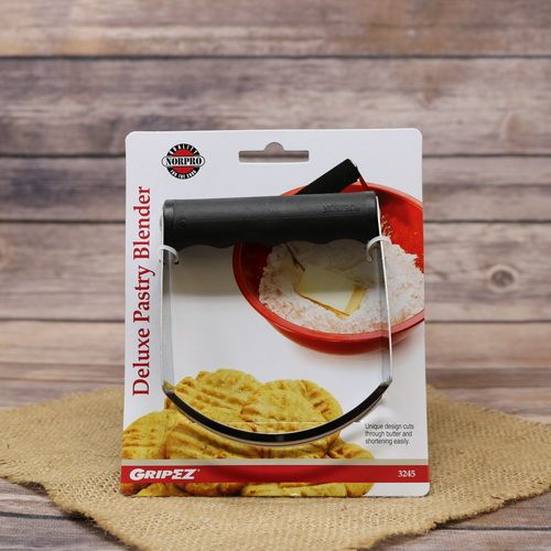 An EZ Grip Pastry Blender, on rustic burlap with a wooden background.