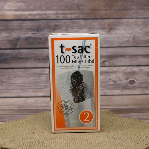 A box of T-Sac Tea Filters, on rustic burlap with a wooden background.