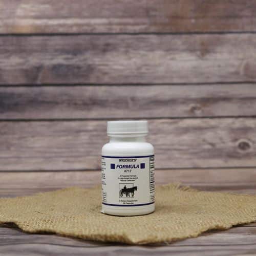 A 56 capsule bottle of Speicher's Formula 717, set on rustic burlap with a wooden background.