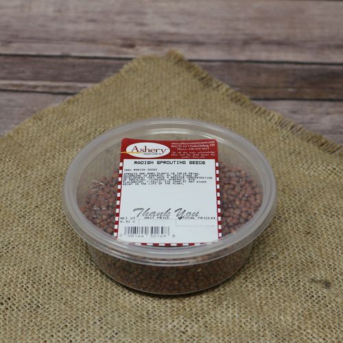 A round plastic container of Radish Sprouting Seeds, set on rustic burlap with a wooden background.