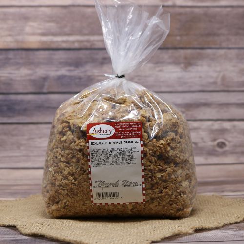A clear bag of Schlabachs Maple Grand-Ola on rustic burlap with a wooden background.