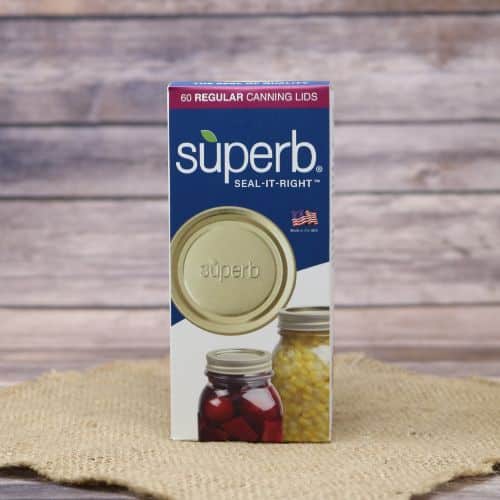 A 60 count box of Superb Regular Canning Lids, on rustic burlap with a wooden background.