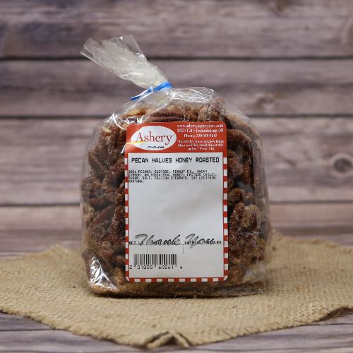 A plastic bag of Honey Roasted Pecan Halves closed with a twist tie, set on rustic burlap with a wooden background.