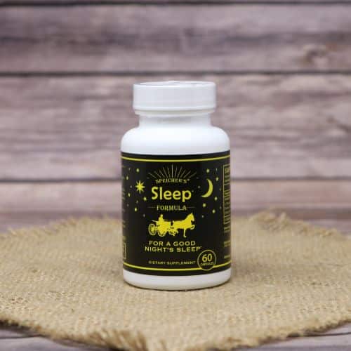 A 60 capsule bottle of Sleep Formula, set on rustic burlap with a wooden background.
