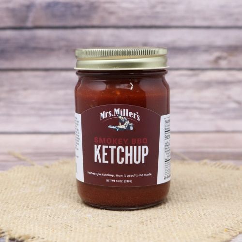 Clear 14oz jar with red and white sticker label filled with ketchup