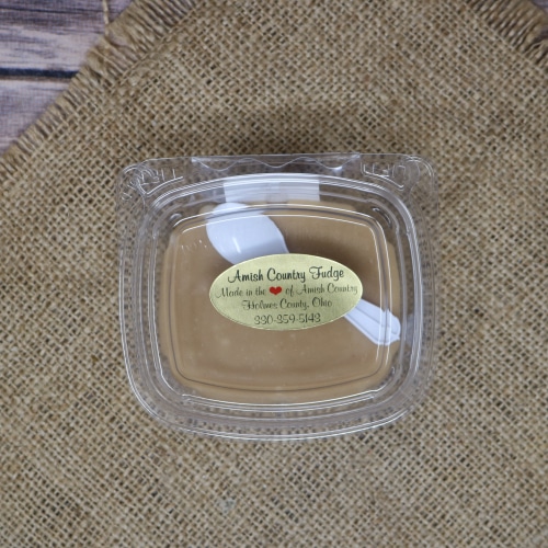 Container of Amish Country Fudge in peanut butter flavor, set against a hessian burlap backdrop, capturing the simplicity of Amish confectionery.