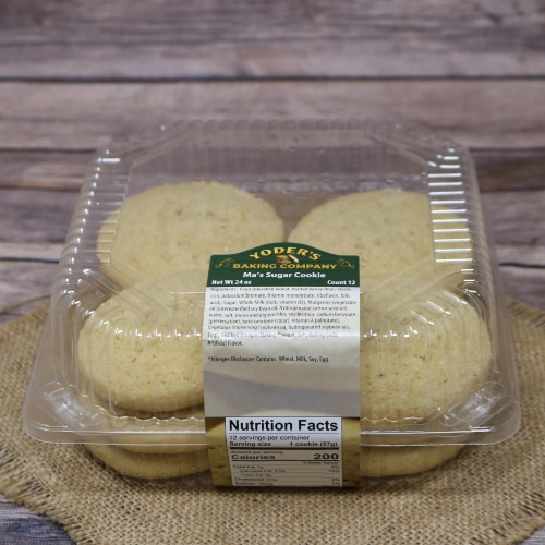 Container of Yoder's Ma's Sugar Cookies on a burlap mat with a rustic wooden background.