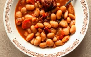 Old Fashioned Bean Soup in a dish with a spoon.