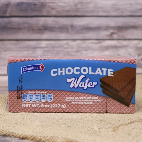 A thin narrow package of Chocolate Wafer Cookies, they are filled with chocolate flavored cream on rustic burlap with a wooden background.